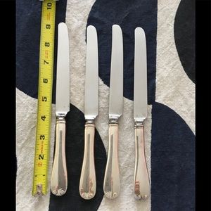 Set of 4 Tiffany Flemish pattern sterling luncheon knives. No monogram.